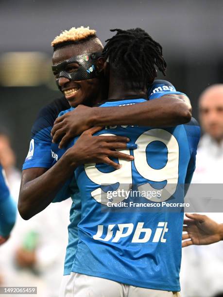 Andre-Frank Zambo Anguissa of SSC Napoli celebrates with teammate Victor Osimhen after scoring the team's first goal during the Serie A match between...