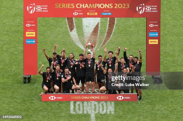 Sam Dickson Captain of New Zealand lifts the HSBC World Series Trophy with his teammates during Day Two of The HSBC London Sevens at Twickenham...