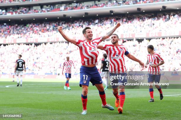 Saul Niguez of Atletico de Madrid celebrates scoring their second goal with teammate Koke during the LaLiga Santander match between Atletico de...