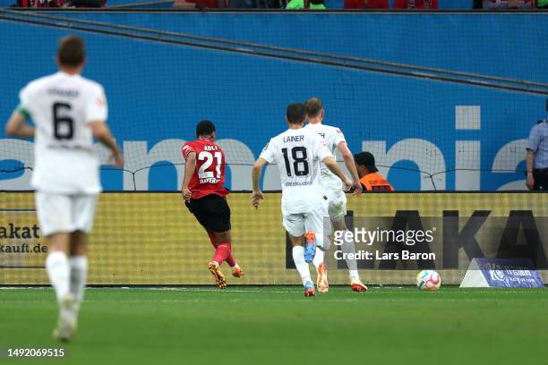 Amine Adli of Bayer 04 Leverkusen scores the team's first goal during the Bundesliga match between Bayer 04 Leverkusen and Borussia Mönchengladbach...