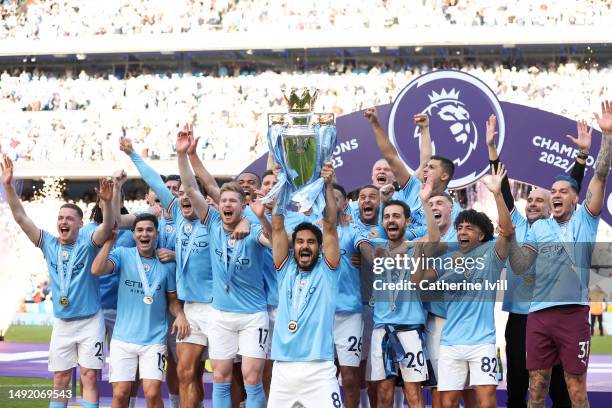 Ilkay Guendogan of Manchester City lifts the Premier League trophy following the Premier League match between Manchester City and Chelsea FC at...