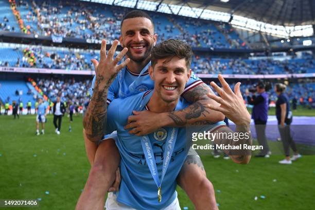 John Stones of Manchester City celebrates with Kyle Walker following the Premier League match between Manchester City and Chelsea FC at Etihad...