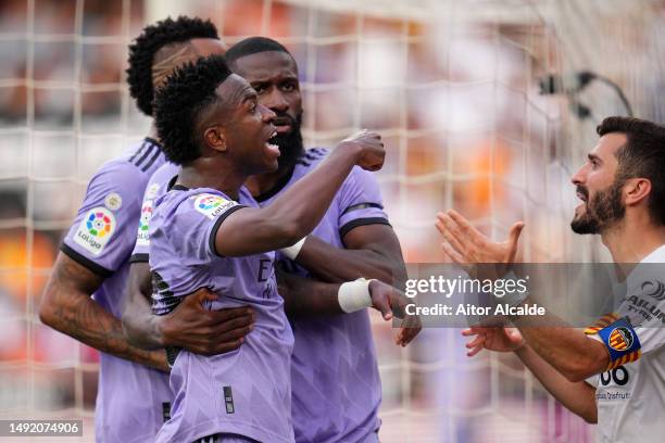 Vinicius Junior of Real Madrid reacts after receiving Racist abuse via gestures made by fans during the LaLiga Santander match between Valencia CF...