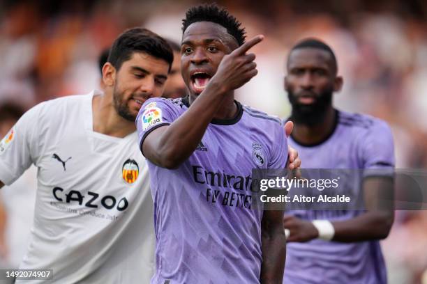 Vinicius Junior of Real Madrid reacts after receiving Racist abuse via gestures made by fans during the LaLiga Santander match between Valencia CF...