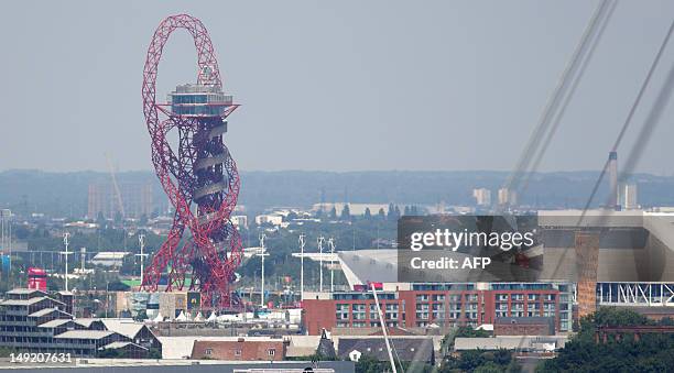 The ArcelorMittal Orbit tower created by Anish Kapoor is seen at the Olympic Park on July 25, 2012 in London where the 2012 Summer Olympic Games will...