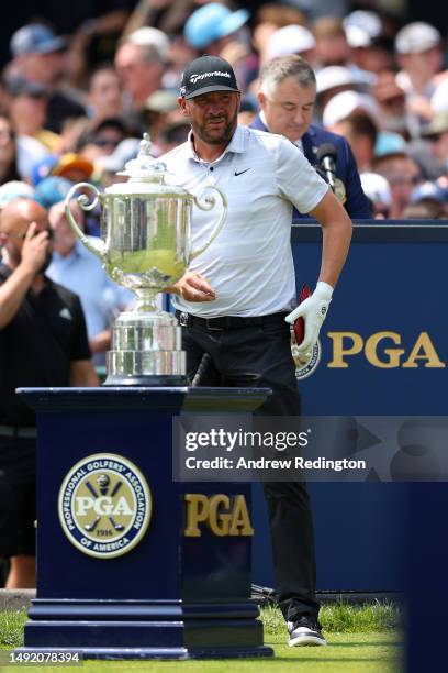 Michael Block of the United States, PGA of America Club Professional, stands near the Wanamaker Trophy on the first tee during the final round of the...