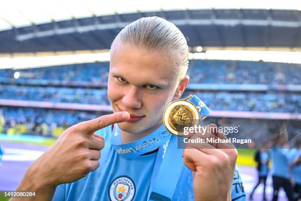 Erling Haaland of Manchester City celebrates with his Premier League winners medal after the Premier League match between Manchester City and Chelsea...