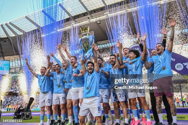 Manchester City captain Ilkay Gundogan lifts the Premier League trophy after the Premier League match between Manchester City and Chelsea FC at...