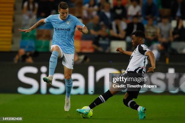 Destiny Udogie of Udinese and Sergej Milinkovic Savic during the Serie A match between Udinese Calcio and SS Lazio at Dacia Arena on May 21, 2023 in...