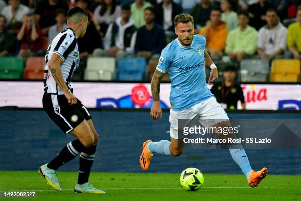 Ciro Immobile of SS Lazio compete for the ball with Nuhuen Perez of Udinese Calcio during the Serie A match between Udinese Calcio and SS Lazio at...