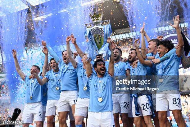 Ilkay Guendogan of Manchester City lifts the Premier League trophy following the Premier League match between Manchester City and Chelsea FC at...