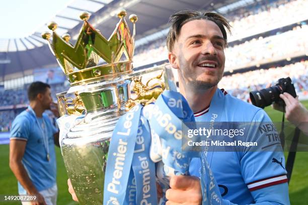 Jack Grealish of Manchester City celebrates with the Premier League trophy following the Premier League match between Manchester City and Chelsea FC...