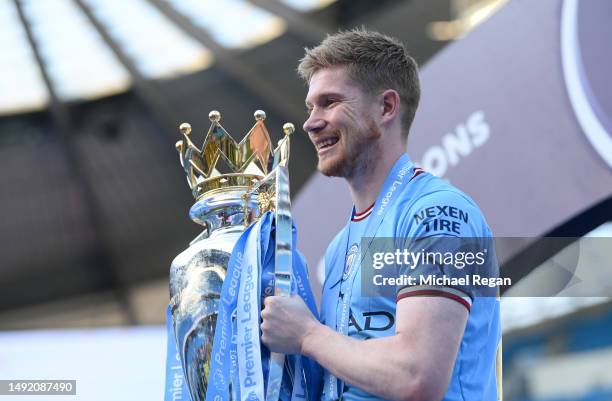 Kevin De Bruyne of Manchester City celebrates with the Premier League trophy following the Premier League match between Manchester City and Chelsea...