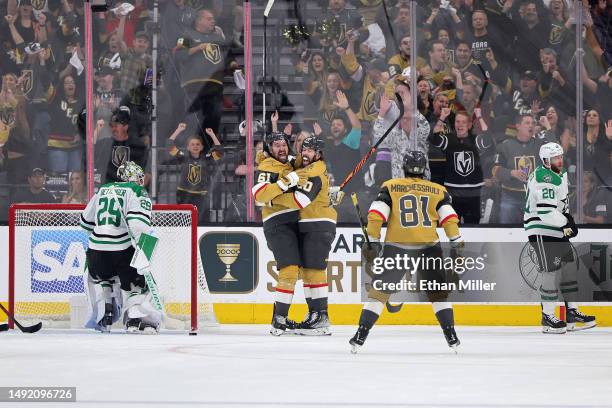 Mark Stone of the Vegas Golden Knights celebrates a goal against the Dallas Stars with teammate Chandler Stephenson during the first period in Game...