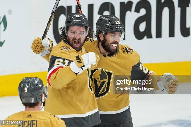 Mark Stone of the Vegas Golden Knights celebrates a goal against the Dallas Stars with teammate Chandler Stephenson during the first period in Game...