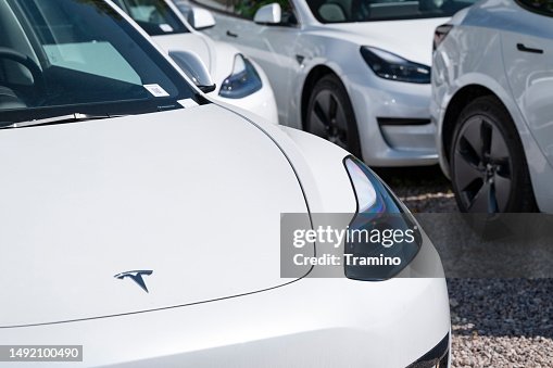 White electric cars on a parking White electric cars on a parking