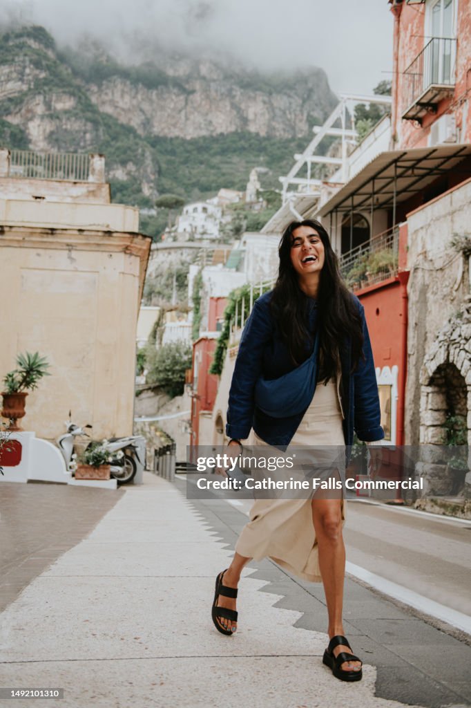 A woman explores the famous streets of Positano, Italy