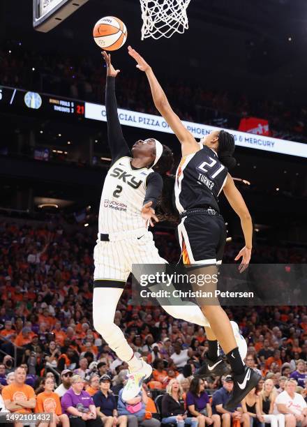 Kahleah Copper of the Chicago Sky lays up a shot past Brianna Turner of the Phoenix Mercury during the first half of the WNBA game at Footprint...