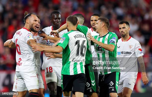 Players of Real Betis and Sevilla FC clash following a foul by Juan Miranda of Real Betis during the LaLiga Santander match between Sevilla FC and...