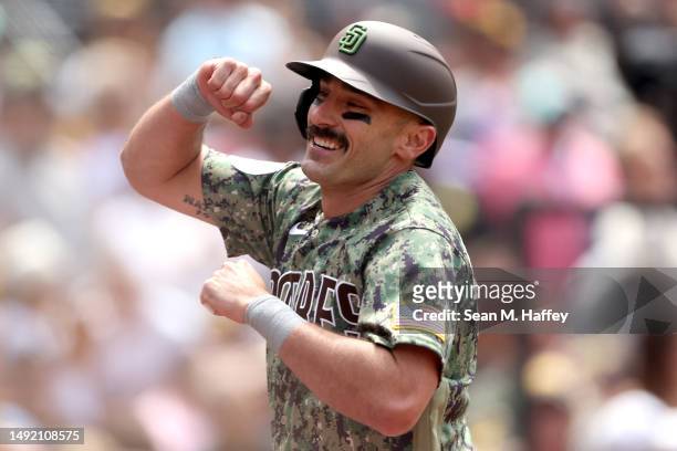 Matt Carpenter of the San Diego Padres reacts after hitting a two-run homerun during the third inning of a game against the Boston Red Sox at PETCO...
