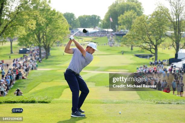 Bryson DeChambeau of the United States plays his shot from the 13th tee during the final round of the 2023 PGA Championship at Oak Hill Country Club...