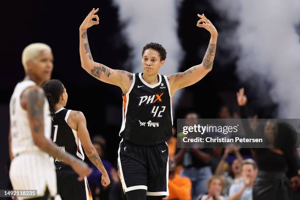 Brittney Griner of the Phoenix Mercury reacts after hitting a three-point shot against the Chicago Sky during the second half of the WNBA game at...
