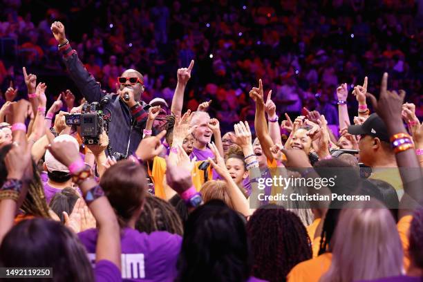 Musician Wyclef Jean performs during the WNBA game between the Phoenix Mercury and the Chicago Sky at Footprint Center on May 21, 2023 in Phoenix,...