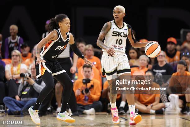Courtney Williams of the Chicago Sky handles the ball against Sug Sutton of the Phoenix Mercury during the second half of the WNBA game at Footprint...
