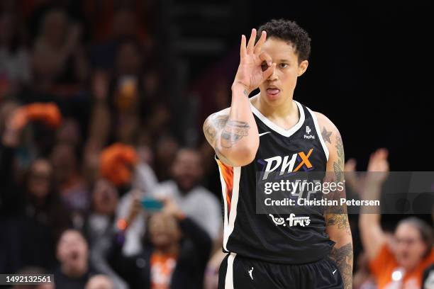 Brittney Griner of the Phoenix Mercury reacts after hitting a three-point shot against the Chicago Sky during the second half of the WNBA game at...