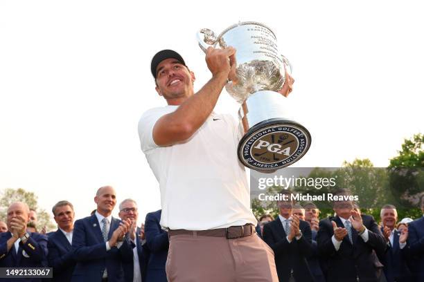 Brooks Koepka of the United States celebrates with the Wanamaker Trophy after winning the 2023 PGA Championship at Oak Hill Country Club on May 21,...