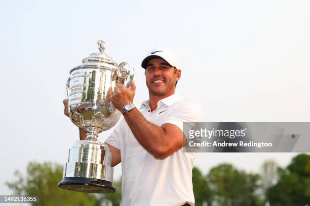 Brooks Koepka of the United States celebrates with the Wanamaker Trophy after winning the 2023 PGA Championship at Oak Hill Country Club on May 21,...