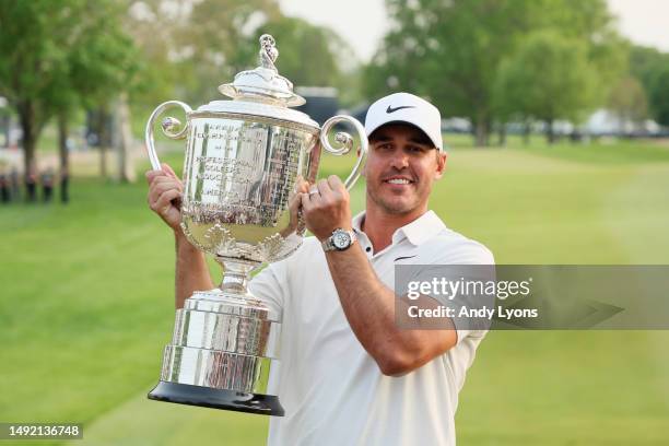 Brooks Koepka of the United States celebrates with the Wanamaker Trophy after winning the 2023 PGA Championship at Oak Hill Country Club on May 21,...