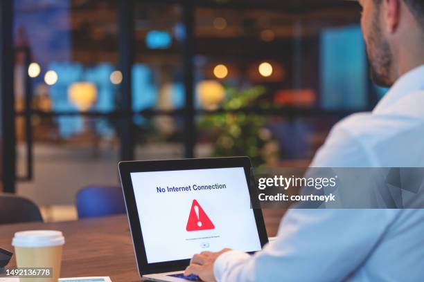 businessman looking at an internet failure screen on a computer. - access icon stock pictures, royalty-free photos & images