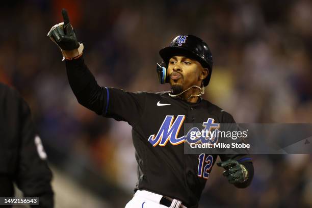 Francisco Lindor of the New York Mets reacts after hitting a solo home run in the sixth inning against the Cleveland Guardians at Citi Field, in game...