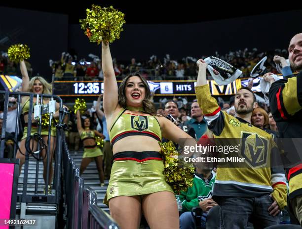 Members of the Vegas Golden Knights Vegas Vivas cheerleaders celebrate with fans after Mark Stone of the Golden Knights scored a power-play goal...