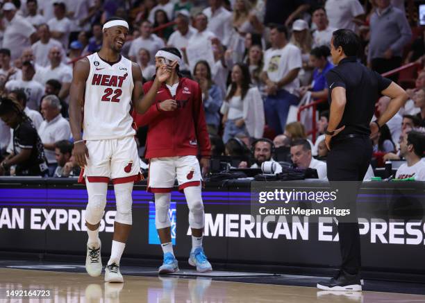 Jimmy Butler of the Miami Heat talks with Head coach Erik Spoelstra during the second quarter against the Boston Celtics in game three of the Eastern...