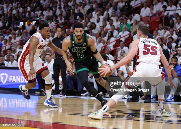 Jayson Tatum of the Boston Celtics drives against Kyle Lowry of the Miami Heat during the second quarter in game three of the Eastern Conference...