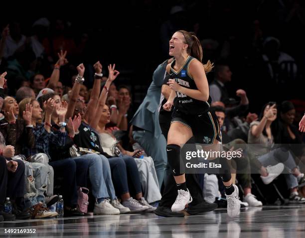 Sabrina Ionescu of the New York Liberty celebrates her three point shot in the first half against the Indiana Fever at Barclays Center on May 21,...