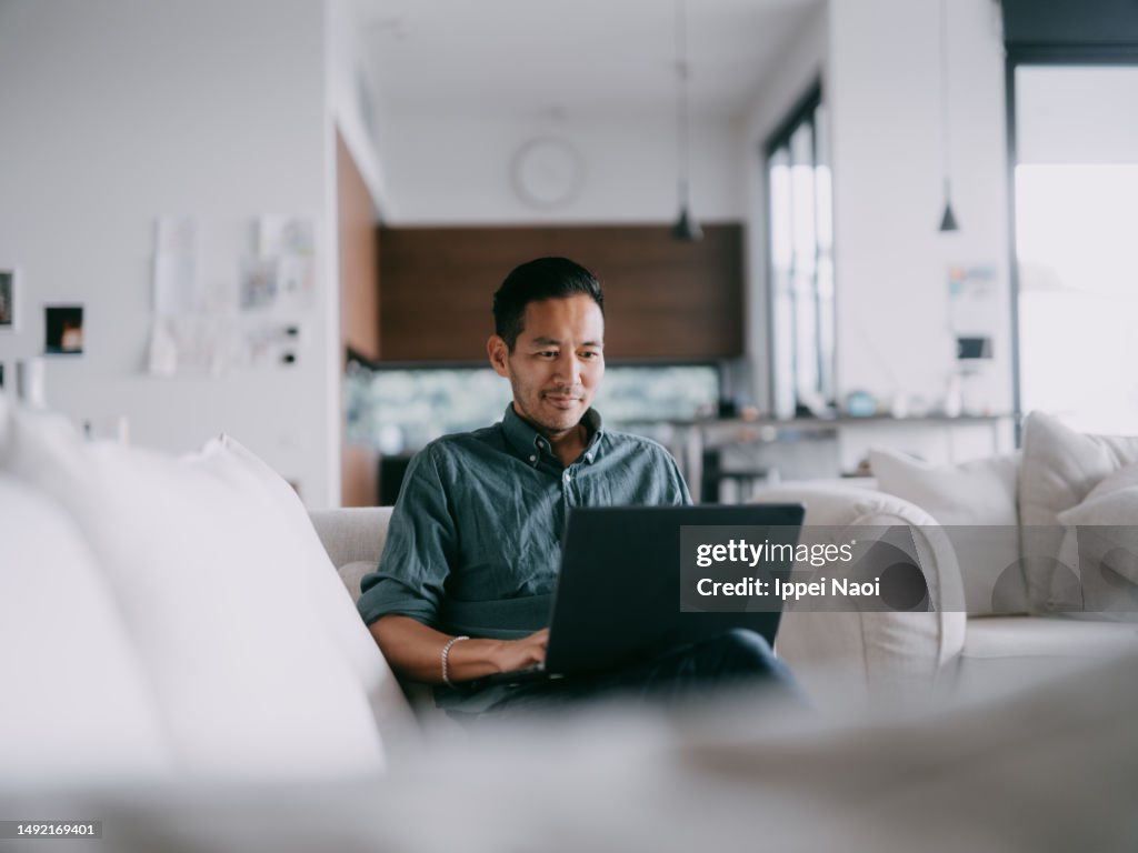 Man working with laptop at home