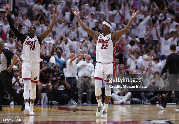 Jimmy Butler and Bam Adebayo of the Miami Heat react during the third quarter against the Boston Celtics in game three of the Eastern Conference...