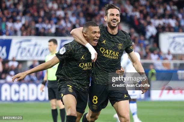 Kylian Mbappe of PSG celebrates his first goal with Fabian Ruiz Pena during the Ligue 1 Uber Eats match between AJ Auxerre and Paris Saint-Germain at...