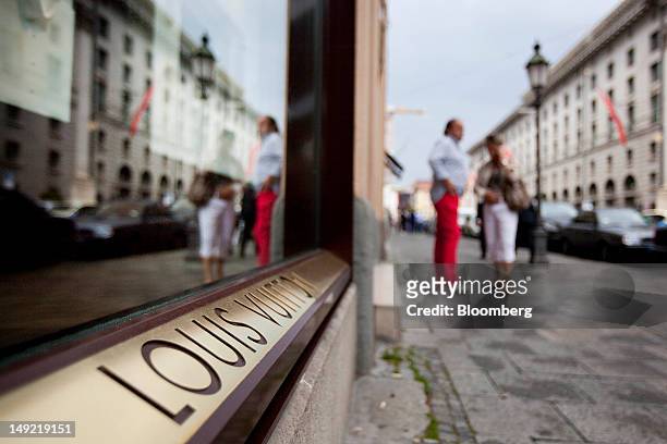 The window for the Louis Vuitton store is seen on Maximilianstrasse in Munich, Germany, on Wednesday, July 25, 2012. Spending at German department...