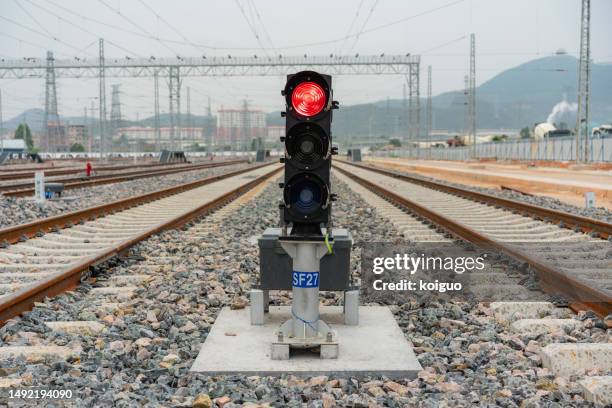 signal lights on the tracks of the high-speed train station - high speed train ストックフォトと画像