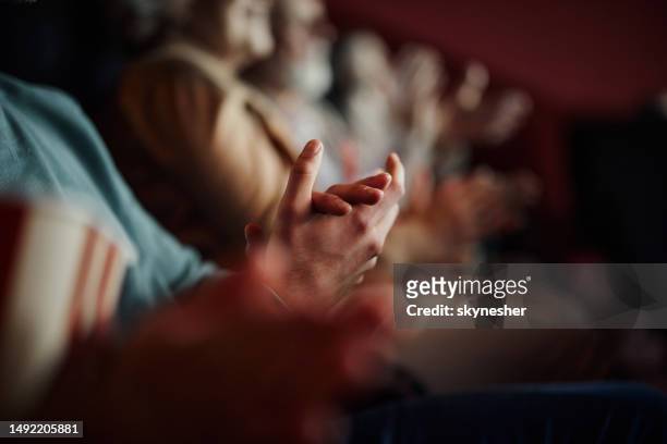 applauding in a movie theatre! - hands applauding stock pictures, royalty-free photos & images