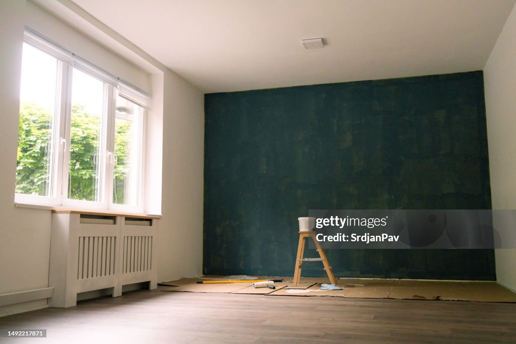 New apartment with a dark blue painted wall