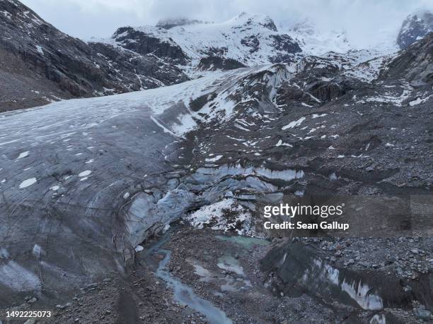 In this aerial view the receding Morteratsch glacier, including a collapsed portion, lies on May 21, 2023 near Pontresina, Switzerland. On June 18...
