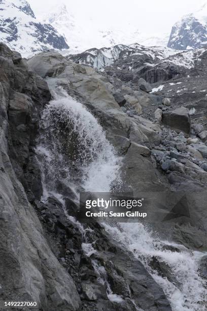 Meltwater gushes down from the receding Morteratsch glacier on May 21, 2023 near Pontresina, Switzerland. On June 18 Swiss voters will go to the...