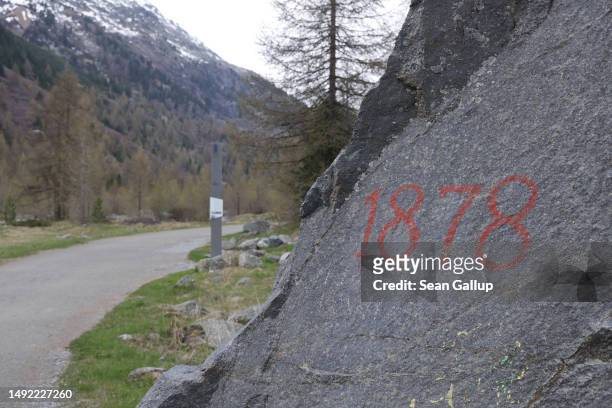 An inscription shows where the receding Morteratsch glacier stood in 1878 on May 21, 2023 near Pontresina, Switzerland. Since then the glacier has...