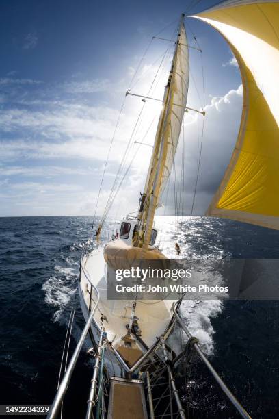 yacht sailing with a storm in the background. southern ocean. australia. - sailboat storm stock pictures, royalty-free photos & images