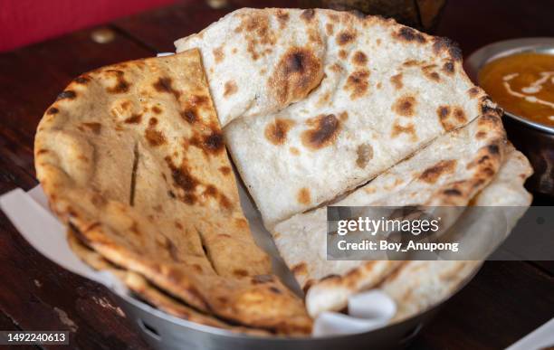 close up of homemade roti (or chapati) served on table. - roti stock pictures, royalty-free photos & images